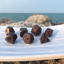 Load image into Gallery viewer, Dwarven Relics Dice Set What is lost may yet be found, treasure deep in dungeons bound…These antique brass dice with a cracked texture ask the player to imagine dwarven constructs, steampunk engines, corroded armors, and forgotten technologies that have been lost to time. These have a hefty weight to them. They are great for artificers, dwarves, constructs, and creatures of draconic descent.